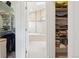 Bathroom featuring a soaking tub with a glass shower in the background at 1511 S Pennsylvania St, Denver, CO 80210