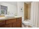Bathroom with modern fixtures, a vessel sink, wood vanity, and a shower-over-tub design at 1511 S Pennsylvania St, Denver, CO 80210