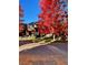 Attractive two-story home showcasing a lush lawn, mature foliage, and a decorative metal fence at 1511 S Pennsylvania St, Denver, CO 80210