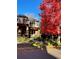 Beautiful two-story home with a well-maintained lawn, a decorative fence, and mature trees at 1511 S Pennsylvania St, Denver, CO 80210