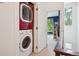 Convenient laundry area features a stacked washer and dryer with easy access to the main living spaces at 1511 S Pennsylvania St, Denver, CO 80210