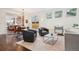 Bright, airy living room and dining room with hardwood floors and modern lighting at 1511 S Pennsylvania St, Denver, CO 80210