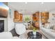 Open-concept living room and kitchen with modern finishes and hardwood floors at 1511 S Pennsylvania St, Denver, CO 80210