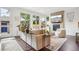 Cozy living room with hardwood floors, comfortable seating, and plenty of natural light at 1511 S Pennsylvania St, Denver, CO 80210