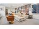 Spacious living room boasts stylish decor, comfortable seating, and ample natural light for relaxation at 1511 S Pennsylvania St, Denver, CO 80210