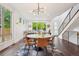 Bright living and dining area featuring hardwood floors and ample natural light at 1511 S Pennsylvania St, Denver, CO 80210