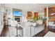 Stylish living area flowing into an open kitchen with modern appliances and a breakfast bar at 1511 S Pennsylvania St, Denver, CO 80210