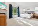 Light and airy main bedroom featuring a fireplace, plush carpet, and large windows with beautiful views at 1511 S Pennsylvania St, Denver, CO 80210