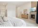 Stylish main bedroom with fireplace, television, and elegant decor at 1511 S Pennsylvania St, Denver, CO 80210