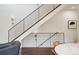 Contemporary staircase with metal railings and wood treads, leading to upper level at 1511 S Pennsylvania St, Denver, CO 80210