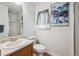 Bright bathroom with a glass shower door and white vanity sink at 10121 Wyandott Cir, Thornton, CO 80260