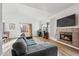 Bright living area with a modern fireplace, vaulted ceiling, and open layout, ideal for entertaining at 10121 Wyandott Cir, Thornton, CO 80260