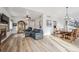Spacious living and dining area boasting hardwood floors, neutral tones, and ample space for gatherings at 10121 Wyandott Cir, Thornton, CO 80260