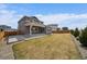 Backyard featuring a covered patio, well-maintained lawn, and privacy fence at 11741 Magnolia St, Thornton, CO 80233