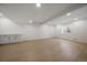 Spacious basement with modern lighting, offering versatile living space at 11741 Magnolia St, Thornton, CO 80233