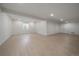 Expansive basement with modern lighting and ample space for entertaining at 11741 Magnolia St, Thornton, CO 80233