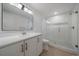 Modern bathroom featuring a glass-enclosed shower and stylish vanity at 11741 Magnolia St, Thornton, CO 80233
