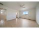 Large, bright bedroom featuring a ceiling fan, a window, and light wood flooring at 11741 Magnolia St, Thornton, CO 80233
