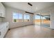 Bright open dining area with large windows and sliding door leading to the backyard patio at 11741 Magnolia St, Thornton, CO 80233