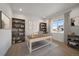 Well-lit home office with large window, built-in bookshelves, and neutral décor at 11741 Magnolia St, Thornton, CO 80233