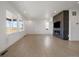 Bright living room with a sleek fireplace and large windows, offering a modern design at 11741 Magnolia St, Thornton, CO 80233