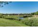 Beautiful green view of a quiet community featuring walking paths and waterways at 4085 S Crystal Cir # 103, Aurora, CO 80014