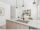 Modern eat-in kitchen features stylish pendant lighting and an island, perfect for meal prep at 5128 W 26Th Ave # 311, Denver, CO 80212