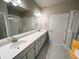 Contemporary bathroom features double sinks with quartz counters and lots of storage at 8428 Galvani Trl # D, Littleton, CO 80129