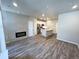 Spacious living space with fireplace, kitchen island, and recessed lighting at 8428 Galvani Trl # D, Littleton, CO 80129
