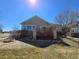 Rear exterior showcasing a wooden deck with brick columns, ideal for outdoor entertaining at 22967 E Mineral Pl, Aurora, CO 80016
