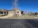 Charming home featuring a well-maintained lawn, attached garage, and neutral siding at 22967 E Mineral Pl, Aurora, CO 80016