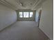Main bedroom features tray ceilings, neutral carpet, and a ceiling fan at 22967 E Mineral Pl, Aurora, CO 80016