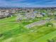 Breathtaking aerial view of the golf course, lakes, and residential area with the city skyline in the background at 2685 S Dayton Way # 145, Denver, CO 80231