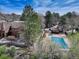Aerial view showcases a community pool and well-maintained grounds at 2685 S Dayton Way # 145, Denver, CO 80231
