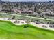 Stunning aerial view of the golf course, community, and neighborhood featuring lush greenery and beautiful residential homes at 2685 S Dayton Way # 145, Denver, CO 80231