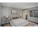 Bedroom with a plush bed, side tables, and a view from the window to the outdoors at 2685 S Dayton Way # 145, Denver, CO 80231