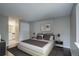 Nicely appointed bedroom with a king bed, modern lamps and ensuite bathroom access at 2685 S Dayton Way # 145, Denver, CO 80231
