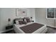 Clean and bright bedroom with a large bed, side tables and art, offers relaxation at 2685 S Dayton Way # 145, Denver, CO 80231