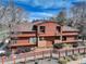 Exterior elevation of stunning multi-story home with mature trees at 2685 S Dayton Way # 145, Denver, CO 80231