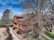 Beautiful exterior view of home in lush, mature landscaping at 2685 S Dayton Way # 145, Denver, CO 80231