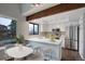 Modern kitchen with white cabinets, stainless steel appliances, and a bright, airy feel at 2685 S Dayton Way # 145, Denver, CO 80231