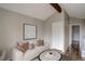 Comfortable living room features a vaulted ceiling with beam and a cozy couch at 2685 S Dayton Way # 145, Denver, CO 80231