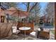 Relaxing patio with brick surround, umbrella, and outdoor seating area at 2685 S Dayton Way # 145, Denver, CO 80231
