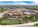 Community clubhouse featuring a putting green, swimming pool, and tennis courts at 27319 E Nova Cir, Aurora, CO 80016