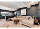 Finished basement with a sectional sofa, creating a comfortable and stylish recreation area at 27319 E Nova Cir, Aurora, CO 80016