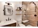 Modern bathroom with walk-in shower and floating shelves at 27319 E Nova Cir, Aurora, CO 80016