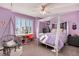 Spacious bedroom with canopy bed and window seat at 27319 E Nova Cir, Aurora, CO 80016