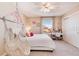 Bright bedroom with hanging chair and window seat at 27319 E Nova Cir, Aurora, CO 80016