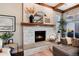 Elegant fireplace with white stone surround and wood mantel at 27319 E Nova Cir, Aurora, CO 80016