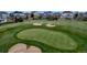 Scenic view of the community golf course showcasing the green and surrounding neighborhood at 27319 E Nova Cir, Aurora, CO 80016